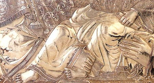 Der Griff Marias unter dem Bein  Christi hindurch